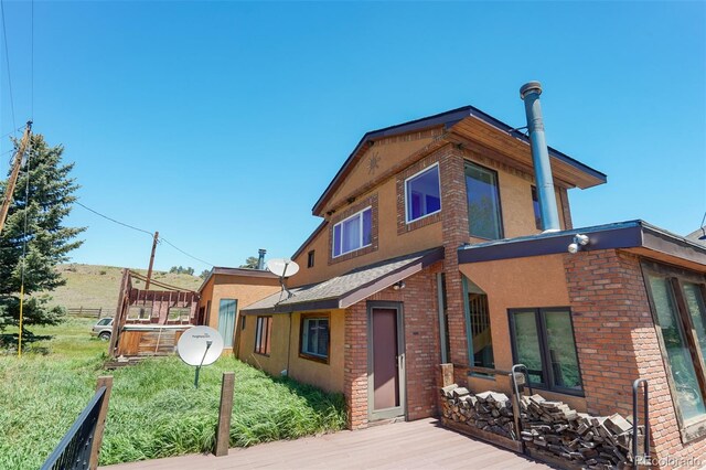 view of front of home with a wooden deck