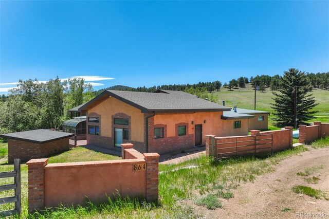 view of side of property featuring a rural view