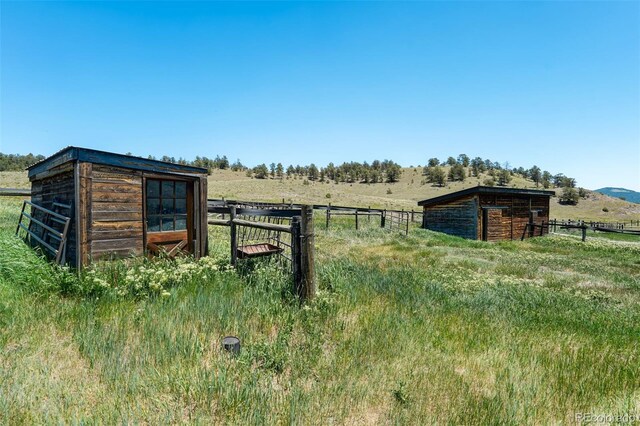 view of outdoor structure featuring a rural view