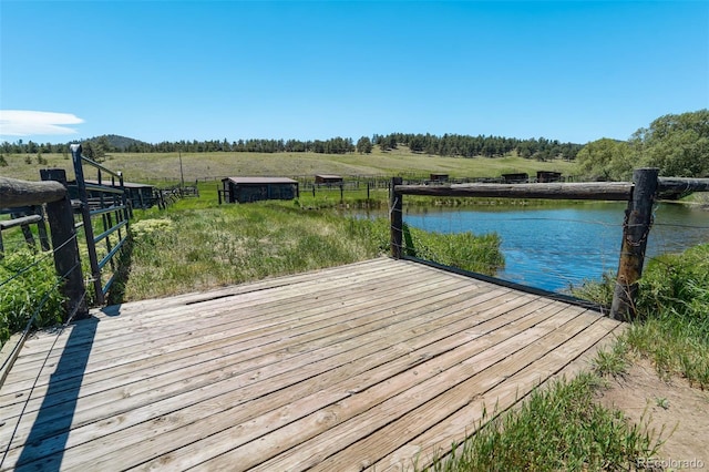 dock area featuring a rural view and a water view