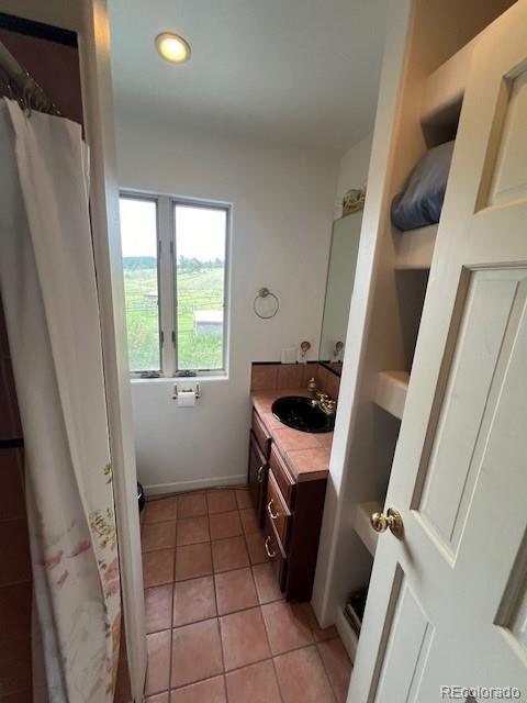 bathroom featuring tile patterned floors and vanity