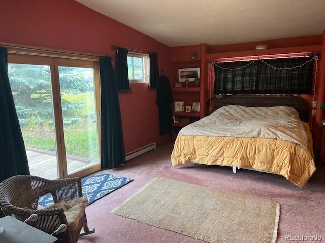 bedroom featuring vaulted ceiling, carpet floors, access to exterior, and a baseboard radiator