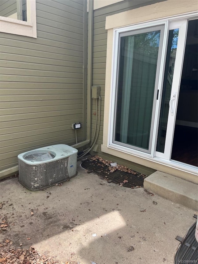 exterior view of central air condition unit and entry steps