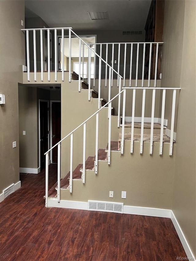 14096 E Radcliff Cir, Aurora, CO 80015 - staircase featuring baseboards and wood finished floors