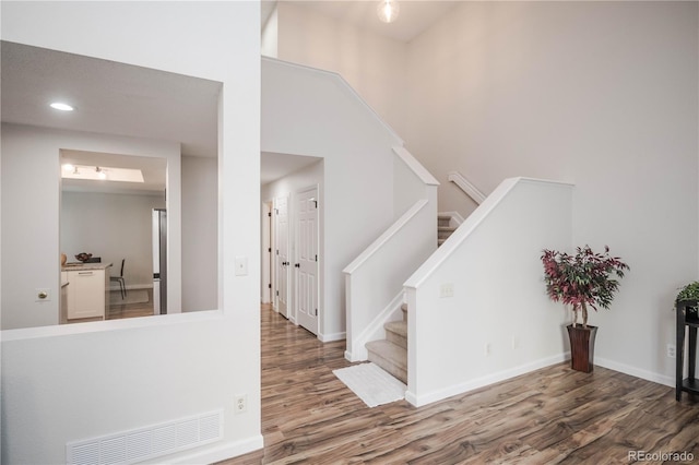 foyer with dark hardwood / wood-style floors