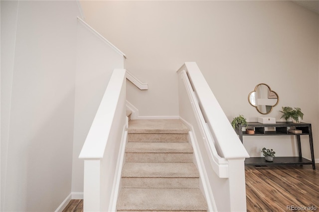 staircase featuring hardwood / wood-style floors