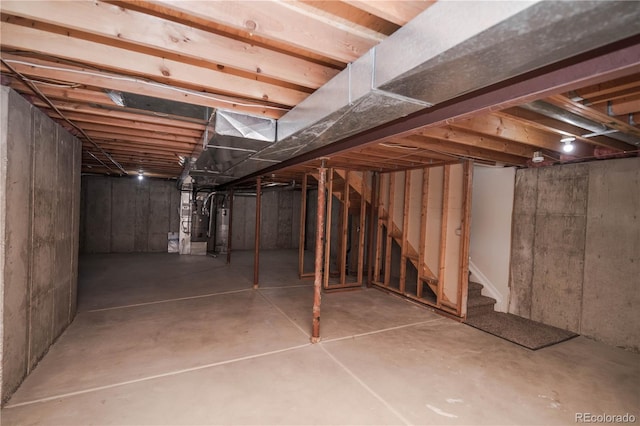 basement with heating unit and water heater