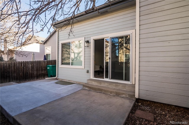 entrance to property featuring a patio area