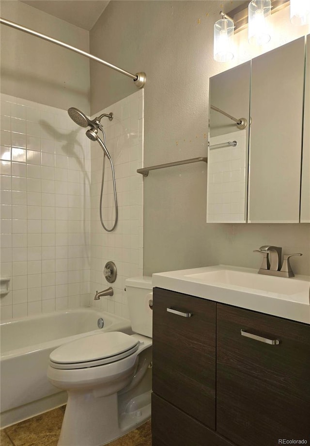 bathroom with toilet, shower / tub combination, tile patterned flooring, and vanity
