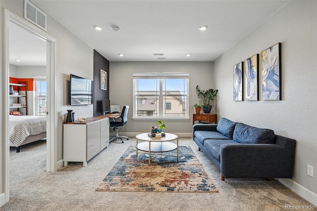living area featuring recessed lighting, carpet floors, baseboards, and visible vents