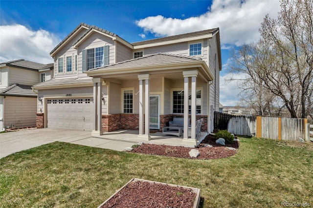 traditional-style home with covered porch, concrete driveway, brick siding, a garage, and fence