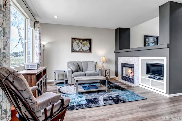 living area with a wealth of natural light and baseboards