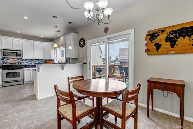 dining room with baseboards, a chandelier, visible vents, and recessed lighting