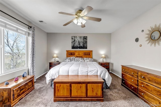 bedroom with carpet floors, visible vents, and baseboards