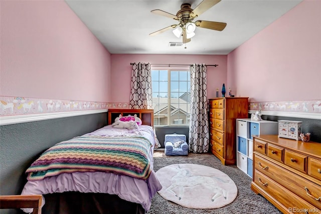 bedroom with visible vents, carpet flooring, and a ceiling fan