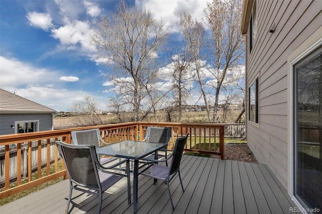 deck with outdoor dining space