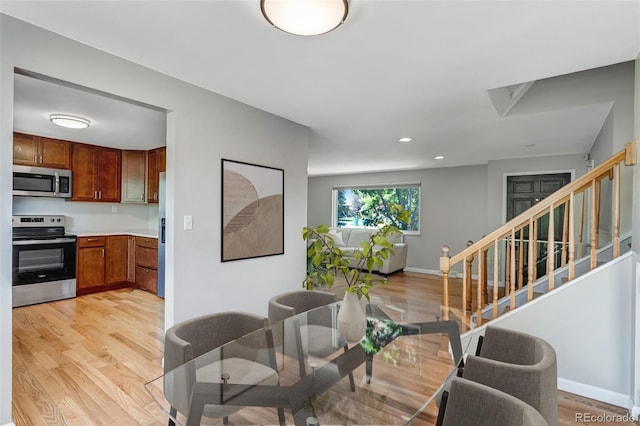 4660 E Briarwood Pl, Centennial, CO 80122 - kitchen with appliances with stainless steel finishes, light wood finished floors, light countertops, recessed lighting, and brown cabinetry