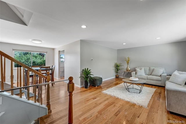 4660 E Briarwood Pl, Centennial, CO 80122 - living area featuring light wood-style flooring, stairs, and recessed lighting