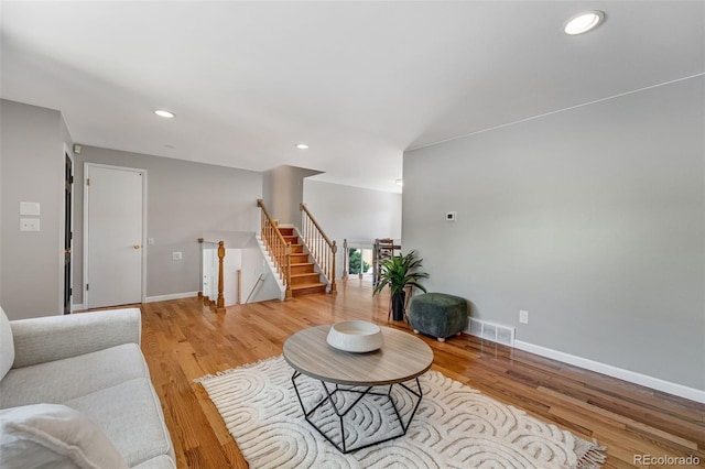 4660 E Briarwood Pl, Centennial, CO 80122 - living area with light wood-style flooring, recessed lighting, and stairway