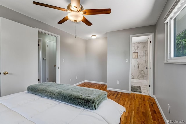 4660 E Briarwood Pl, Centennial, CO 80122 - bedroom featuring wood finished floors, ceiling fan, and connected bathroom