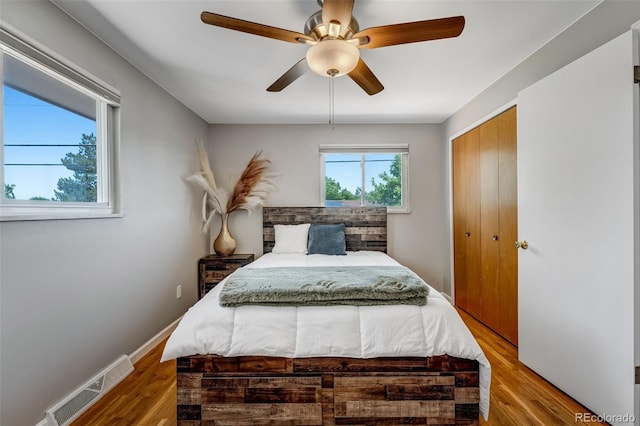 4660 E Briarwood Pl, Centennial, CO 80122 - bedroom with a closet, wood finished floors, and a ceiling fan