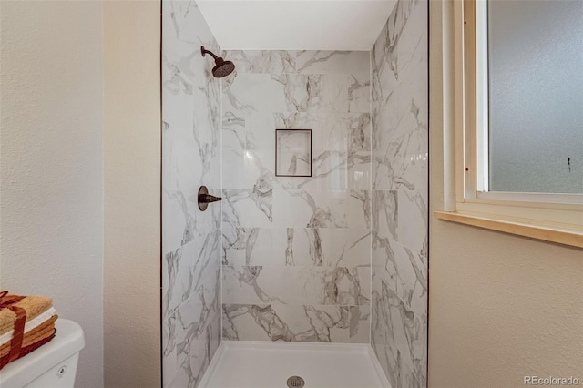 4660 E Briarwood Pl, Centennial, CO 80122 - bathroom featuring tiled shower and toilet
