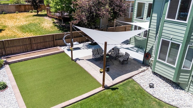 view of yard with a patio and a fenced backyard