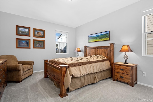 carpeted bedroom featuring baseboards