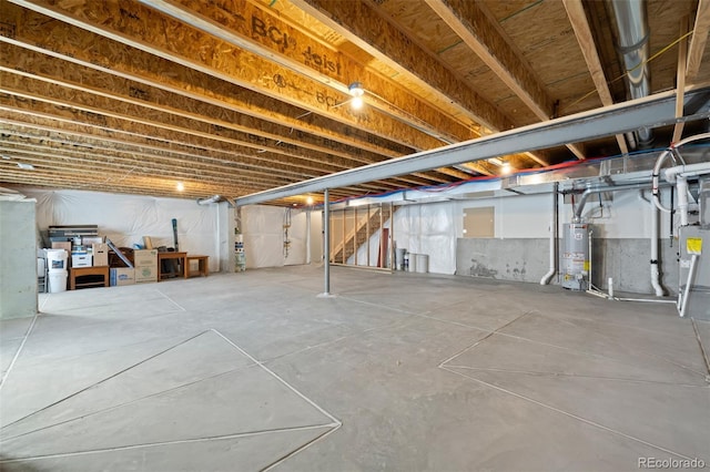 unfinished basement with gas water heater