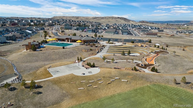 birds eye view of property featuring a mountain view