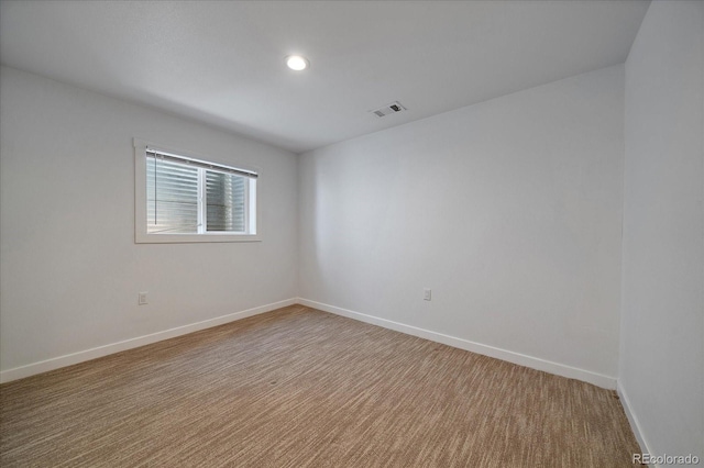unfurnished room with recessed lighting, baseboards, visible vents, and carpet floors