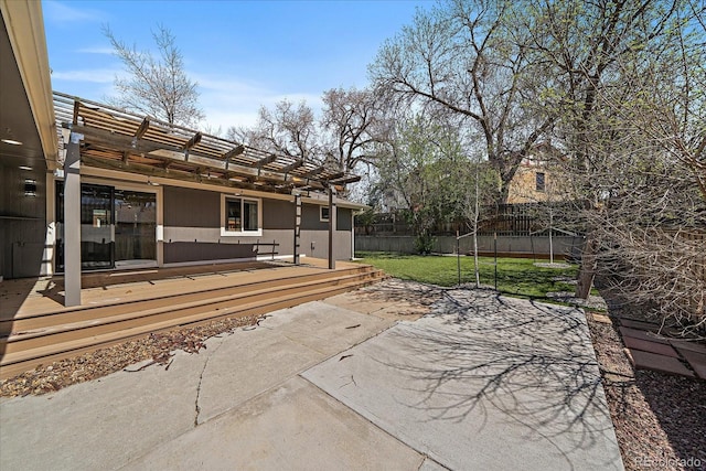 view of patio / terrace with a pergola and fence
