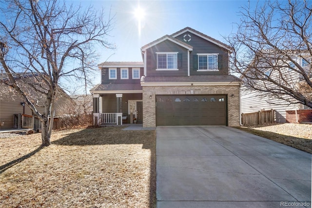 view of front property featuring a garage and covered porch