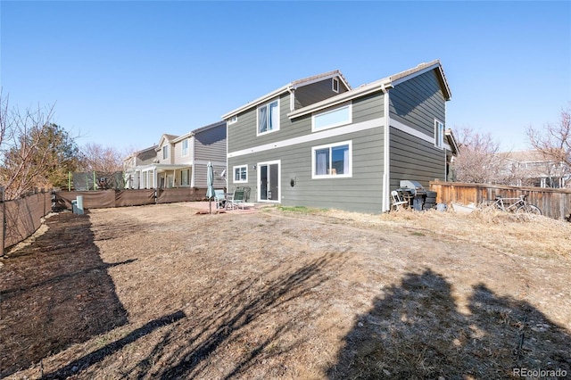 rear view of property featuring a patio area