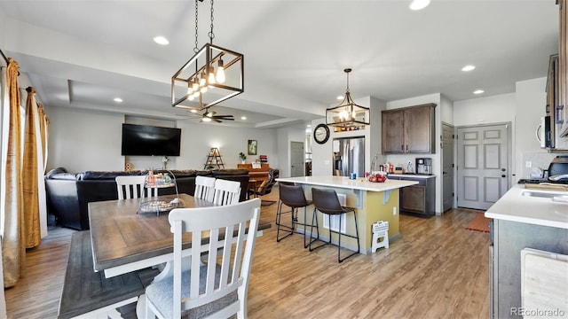 6207 Kildare Dr, Colorado Springs, CO 80927 - dining space with a chandelier, light wood-style floors, and recessed lighting