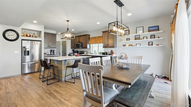 6207 Kildare Dr, Colorado Springs, CO 80927 - dining area with light wood-type flooring, recessed lighting, and a chandelier