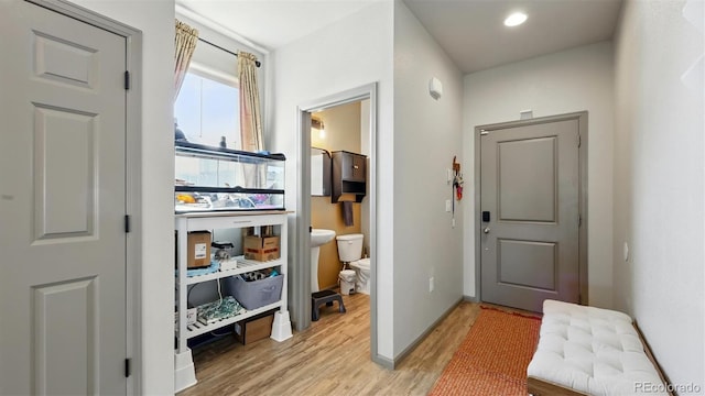 6207 Kildare Dr, Colorado Springs, CO 80927 - hall featuring light wood finished floors and baseboards