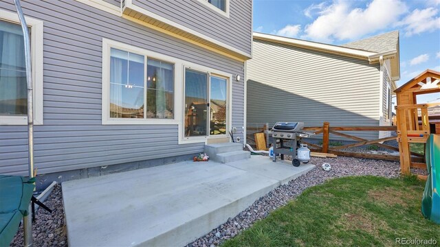 6207 Kildare Dr, Colorado Springs, CO 80927 - view of patio / terrace featuring fence, a grill, and entry steps