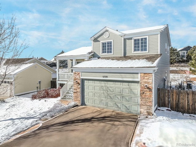 front facade with a garage