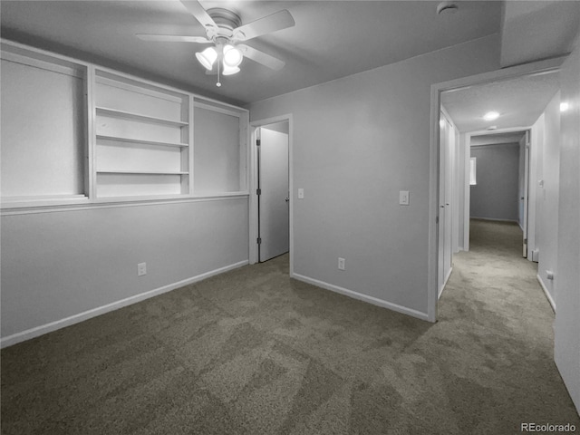 unfurnished bedroom featuring ceiling fan and carpet floors