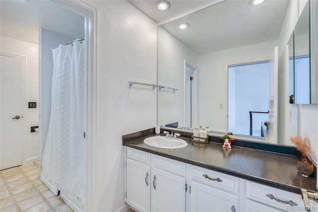 bathroom featuring recessed lighting, vanity, and tile patterned floors