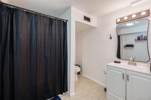 bathroom with baseboards, visible vents, toilet, curtained shower, and vanity