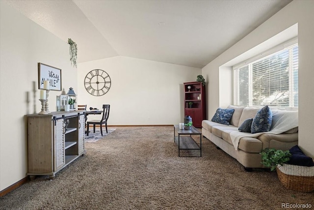 living room with lofted ceiling, carpet flooring, and baseboards