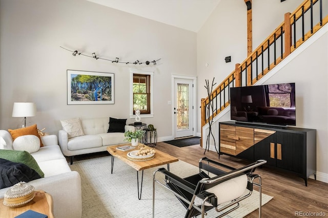713 Rudi Ln, Golden, CO 80403 - living room with stairway, wood finished floors, and high vaulted ceiling