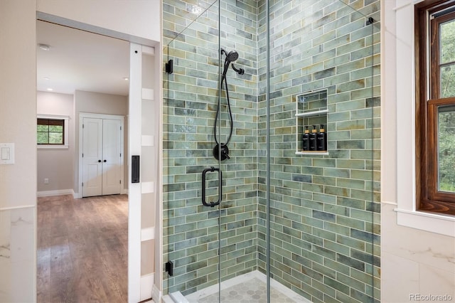 713 Rudi Ln, Golden, CO 80403 - full bathroom featuring a stall shower, plenty of natural light, wood finished floors, and recessed lighting