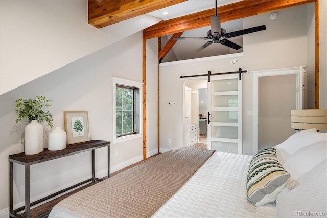 713 Rudi Ln, Golden, CO 80403 - bedroom with beamed ceiling, a barn door, and high vaulted ceiling