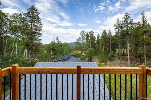 713 Rudi Ln, Golden, CO 80403 - wooden deck featuring a view of trees