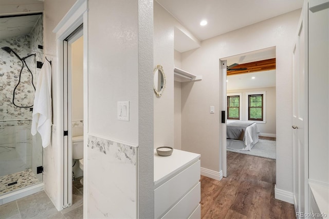 713 Rudi Ln, Golden, CO 80403 - full bath featuring a marble finish shower, wood finished floors, ensuite bathroom, and recessed lighting
