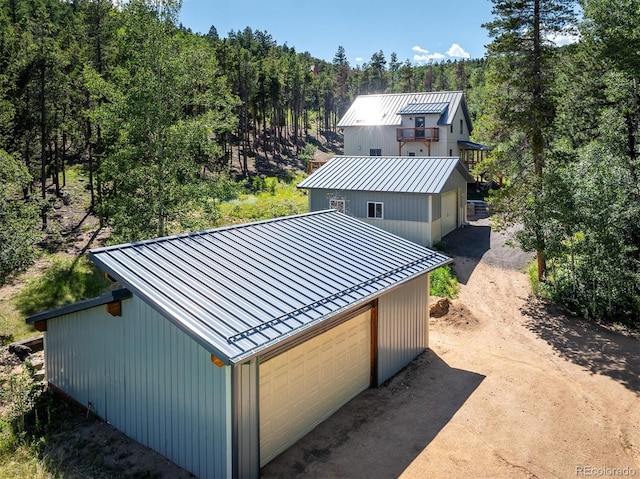 713 Rudi Ln, Golden, CO 80403 - rear view of property with a standing seam roof, a metal roof, and an outdoor structure