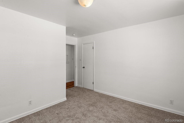 spare room with light colored carpet